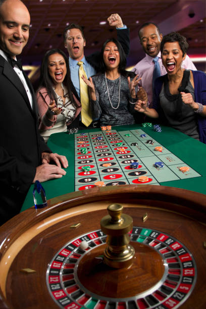 Live Dragon Tiger dealer at kawantoto studio with card table and multiple camera angles